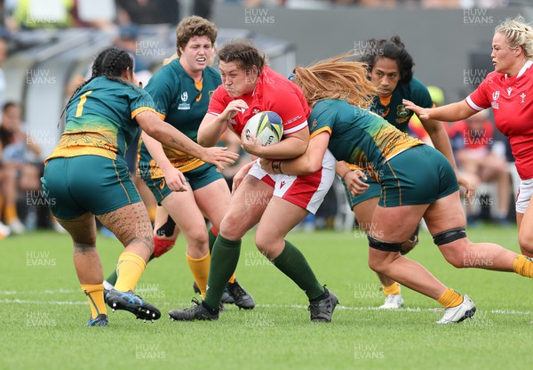 221022 - Australia v Wales, Women’s Rugby World Cup, Pool A - Cerys Hale of Wales takes on Liz Patu of Australia and Bridie O'Gorman of Australia