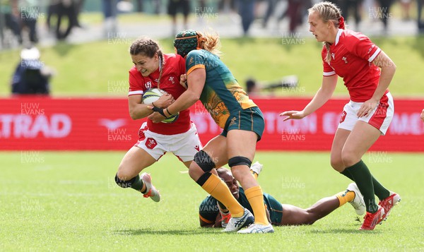 221022 - Australia v Wales, Women’s Rugby World Cup, Pool A - Jasmine Joyce of Wales takes on Ivania Wong of Australia and Emily Chancellor of Australia
