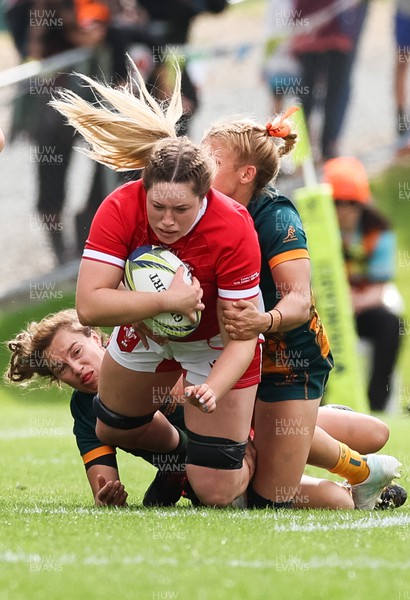 221022 - Australia v Wales, Women’s Rugby World Cup, Pool A - Bethan Lewis of Wales is tackled by Lori Cramer of Australia