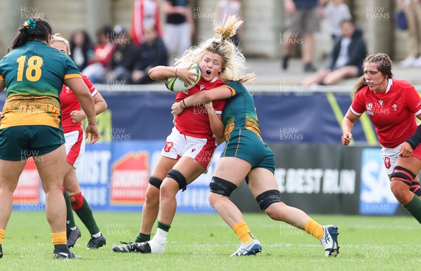 221022 - Australia v Wales, Women’s Rugby World Cup, Pool A - Alex Callender of Wales is challenged by Kaitlan Leaney of Australia