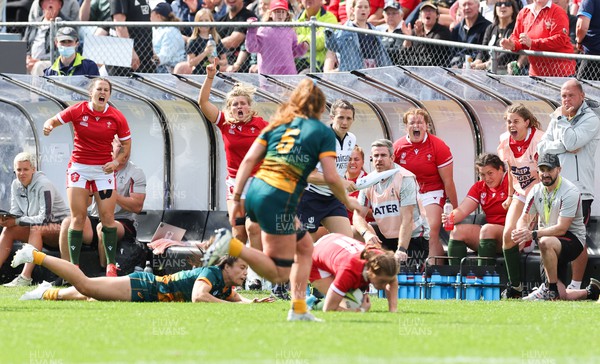 221022 - Australia v Wales, Women’s Rugby World Cup, Pool A - The Wales bench erupts as Lisa Neumann of Wales takes the ball from the kick off