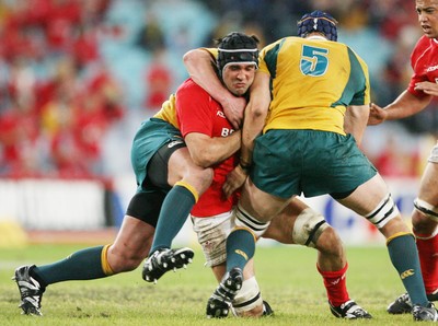 26.05.07  AUSTRALIA v WALES, Telstra Stadium,Sydney Wales Jonathan Thomas is tackled by Guy Sheperdson and Mark Chisolm 