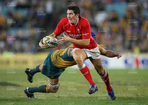 26.05.07  AUSTRALIA v WALES, Telstra Stadium,Sydney Wales James Hook beats tackle by Nathan Sharpe 