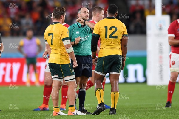 290919 - Australia v Wales - Rugby World Cup - Referee Romain Poite talks to Samu Kerevi of Australia after he charged into Rhys Patchell