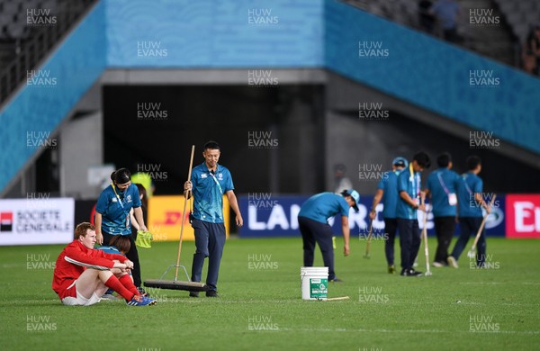 290919 - Australia v Wales - Rugby World Cup - Rhys Patchell of Wales sits on his own after the game whilst grounds staff tend to the field