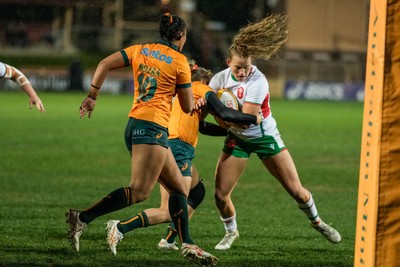 010825 - Australia Women v Wales Women - Carys Cox of Wales is tackled