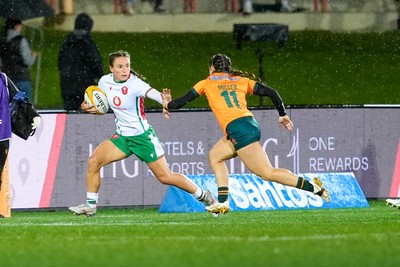 010825 - Australia Women v Wales Women - Jasmine Joyce of Wales looks to hold off Desiree Miller of Australia