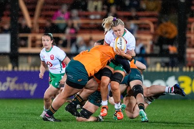010825 - Australia Women v Wales Women - Alex Callender of Wales is tackled