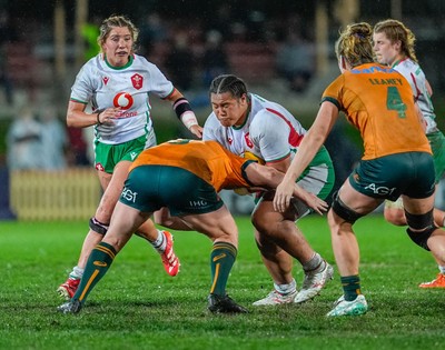 010825 - Australia Women v Wales Women - Sisilia Tuipulotu of Wales is held