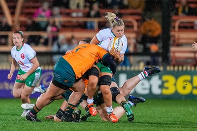 010825 - Australia Women v Wales Women - Alex Callender of Wales is tackled resulting in her having to be replaced