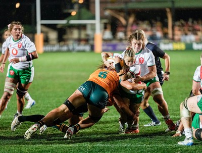 010825 - Australia Women v Wales Women - Keira Bevan of Wales is tackled short of the line