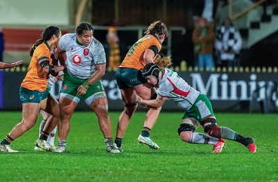 010825 - Australia Women v Wales Women - Bethan Lewis of Wales puts in a tackle