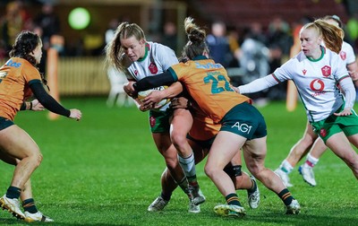 010825 - Australia Women v Wales Women - Carys Cox of Wales is tackled short of the line