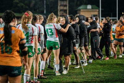 010825 - Australia Women v Wales Women - Alex Callender of Wales on crutches is embraced by Carys Cox of Wales at the end of the match