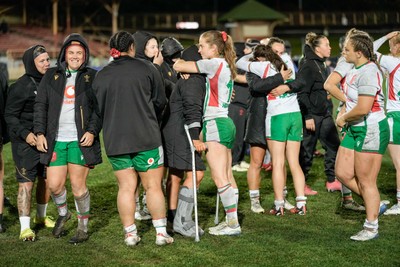 010825 - Australia Women v Wales Women - Wales players embrace each other at the end of the match