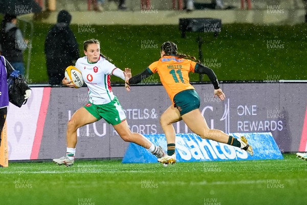 010825 - Australia Women v Wales Women - Jasmine Joyce of Wales looks to hold off Desiree Miller of Australia