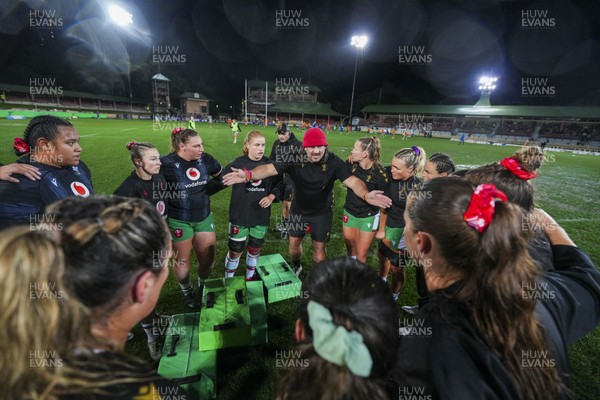 010825 - Australia Women v Wales Women - Dan Murphy, Wales Women defence coach speaks to the players during warm up