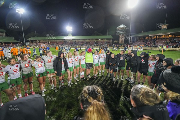 010825 - Australia Women v Wales Women - Alex Callender of Wales speaks to the players as the Wales team huddle up at the end of the match