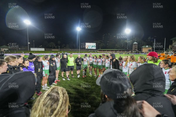 010825 - Australia Women v Wales Women - Sean Lynn, Wales Women head coach, speaks to the players as the Wales team huddle up at the end of the match