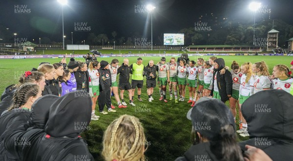 010825 - Australia Women v Wales Women - Sean Lynn, Wales Women head coach, speaks to the players as the Wales team huddle up at the end of the match