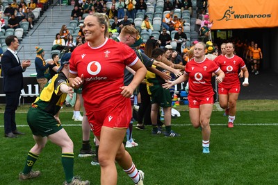 260725 - Australia Women v Wales Women - Kelsey Jones of Wales leads the team out on her 50th cap