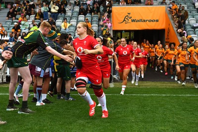 260725 - Australia Women v Wales Women - Bethan Lewis of Wales runs out at the start of the match