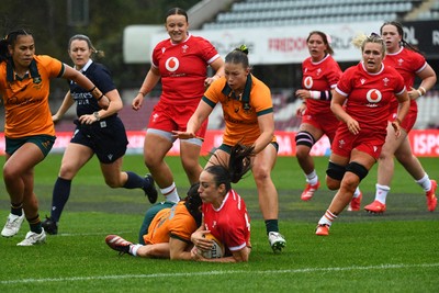 260725 - Australia Women v Wales Women - Nel Metcalfe of Wales is tackled short of the line