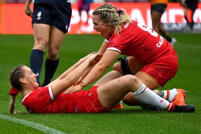 260725 - Australia Women v Wales Women - Hannah Dallavalle of Wales is congratulated by Alex Callender of Wales after she dives in to score try