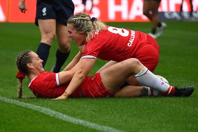 260725 - Australia Women v Wales Women - Hannah Dallavalle of Wales is congratulated by Alex Callender of Wales after she dives in to score try