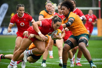 260725 - Australia Women v Wales Women - Courtney Keight of Wales is tackled