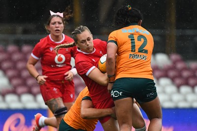 260725 - Australia Women v Wales Women - Hannah Dallavalle of Wales is held