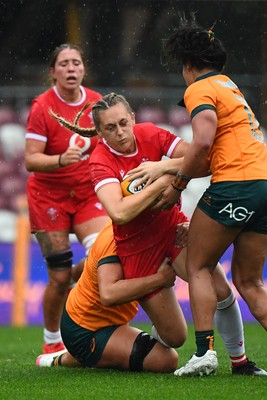 260725 - Australia Women v Wales Women - Hannah Dallavalle of Wales is held
