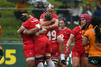 260725 - Australia Women v Wales Women - Sisilia Tuipulotu of Wales, Bethan Lewis of Wales and Bryonie King of Wales celebrate on the final whistle
