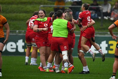 260725 - Australia Women v Wales Women - Wales players celebrate on the final whistle
