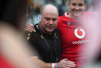 260725 - Australia Women v Wales Women - Sean Lynn, Wales Women head coach, speaks to the players at the end of the match