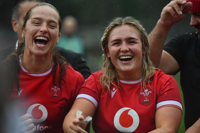 260725 - Australia Women v Wales Women - Lisa Neumann of Wales, left, and Alex Callender of Wales at the end of the match