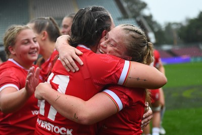260725 - Australia Women v Wales Women - Seren Lockwood of Wales and Katherine Baverstock of Wales celebrate at the end of the match