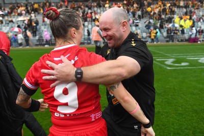 260725 - Australia Women v Wales Women - Sean Lynn, Wales Women head coach celebrates with Keira Bevan of Wales at the end of the match
