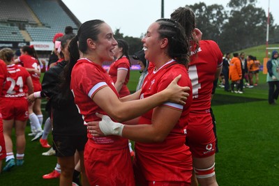 260725 - Australia Women v Wales Women - Nel Metcalfe of Wales and Katherine Baverstock of Wales celebrate at the end of the match