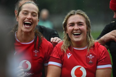 260725 - Australia Women v Wales Women - Lisa Neumann of Wales, left, and Alex Callender of Wales at the end of the match