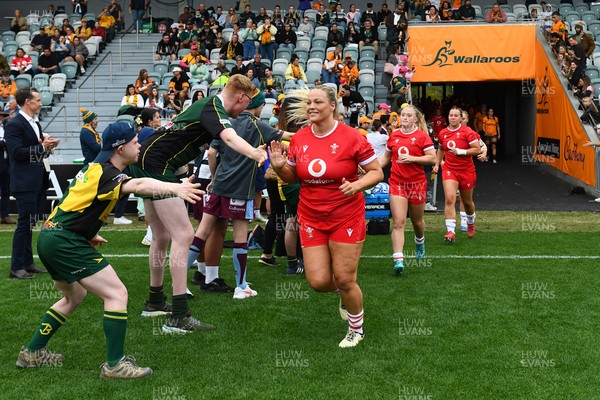 260725 - Australia Women v Wales Women - Kelsey Jones of Wales leads the team out on her 50th cap