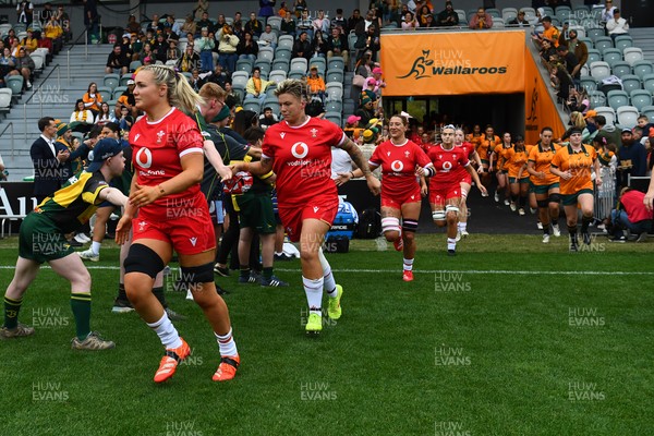 260725 - Australia Women v Wales Women - Alex Callender of Wales runs out at the start of the match