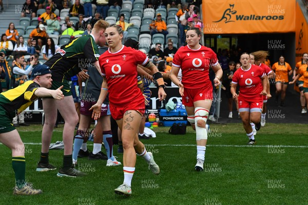 260725 - Australia Women v Wales Women - Keira Bevan of Wales and Gwen Crabb of Wales run out at the start of the match