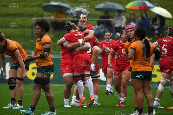 260725 - Australia Women v Wales Women - Sisilia Tuipulotu of Wales, Bethan Lewis of Wales and Bryonie King of Wales celebrate on the final whistle
