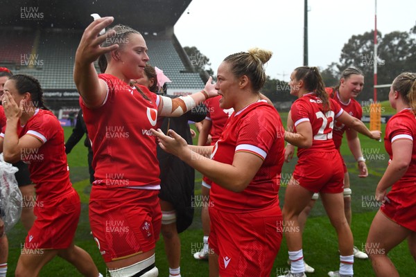 260725 - Australia Women v Wales Women - Tilly Vucaj and Kelsey Jones of Wales celebrate at the end of the match