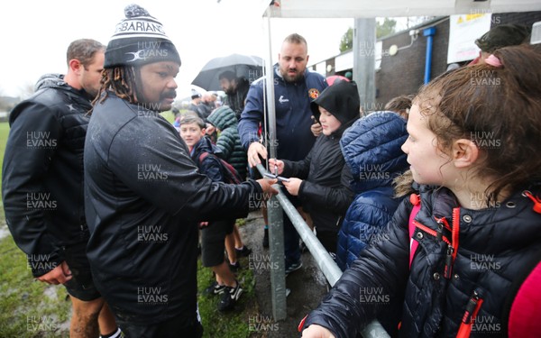 271119 - Barbarians Rugby Training Session, Penarth RFC - Mathieu Bastareaud signs autographs for local schoolchildren after the Barbarians training session at Penarth RFC ahead of their match against Wales