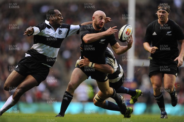 05.12.09 - Barbarians v New Zealand - The MasterCard Trophy - Wyatt Crockett of New Zealand is tackled by Joe Rokocoko and Victor Matfield of Barbarians. 