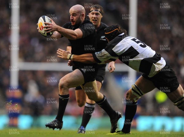 05.12.09 - Barbarians v New Zealand - The MasterCard Trophy - Wyatt Crockett of New Zealand is tackled by Victor Matfield of Barbarians. 