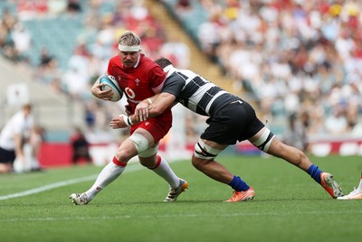 270626 - Barbarians v Wales - Friendly - Aaron Wainwright of Wales is tackled by Lachlan Boshier of Barbarians 