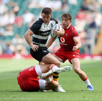 270626 - Barbarians v Wales - Friendly - Andrew Kellaway of Barbarians is tackled by Kieran Hardy of Wales 